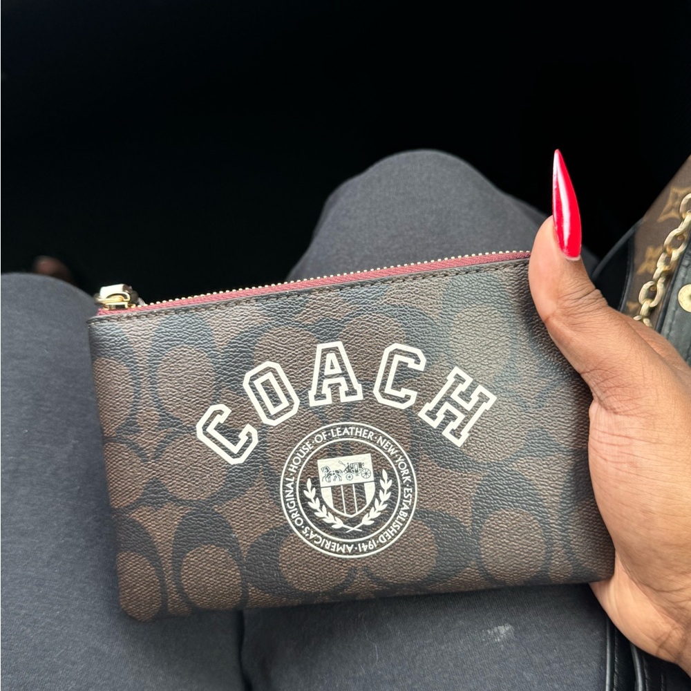 dark brown coach wristlet